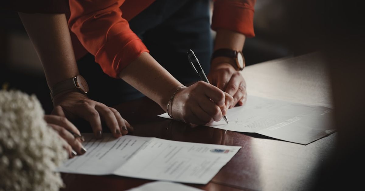 Signed mortgage decision in principle letter alongside loan documents on a desk