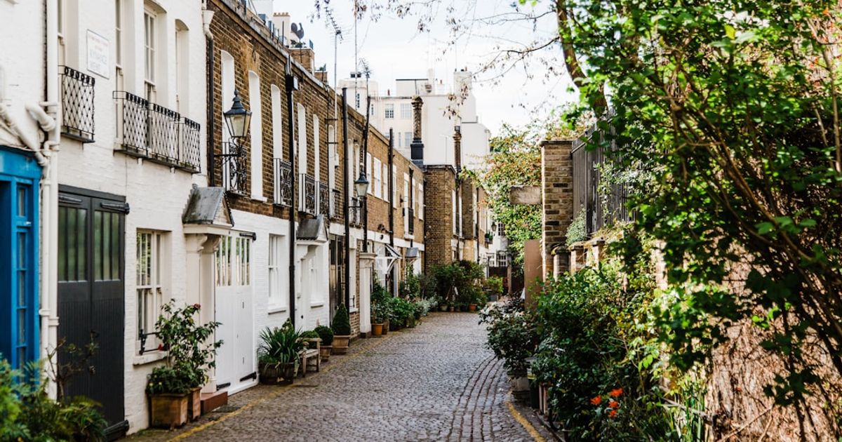 London prime residential townhouse facade on a quiet street, typical UK bridging loan security