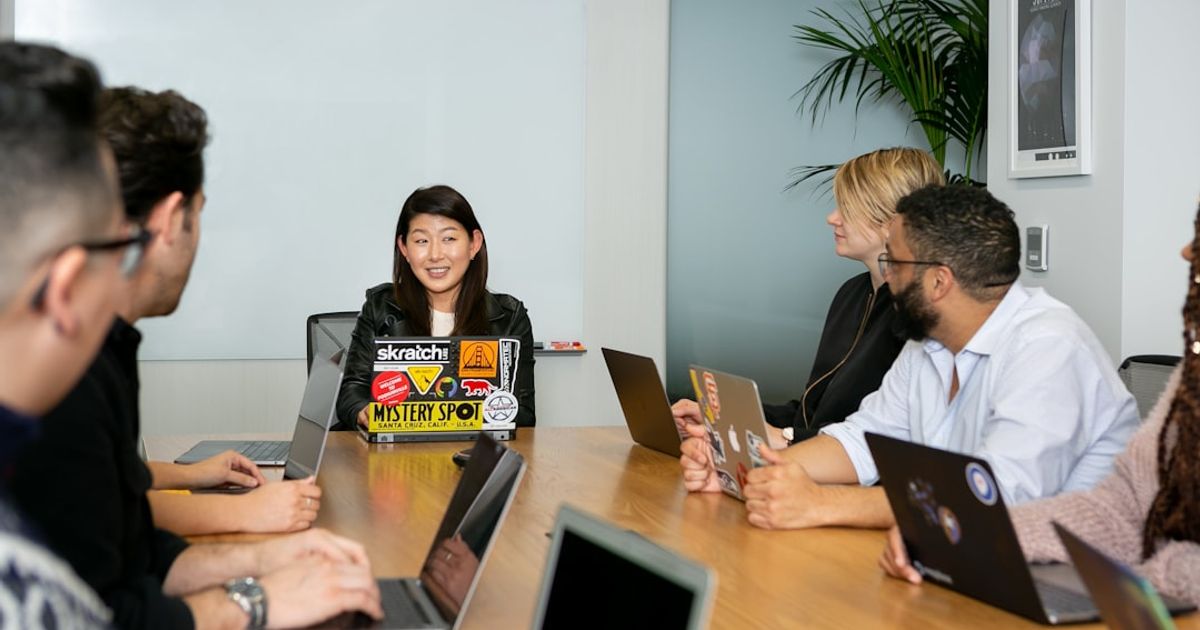 Private banker and client reviewing property documents in Singapore office