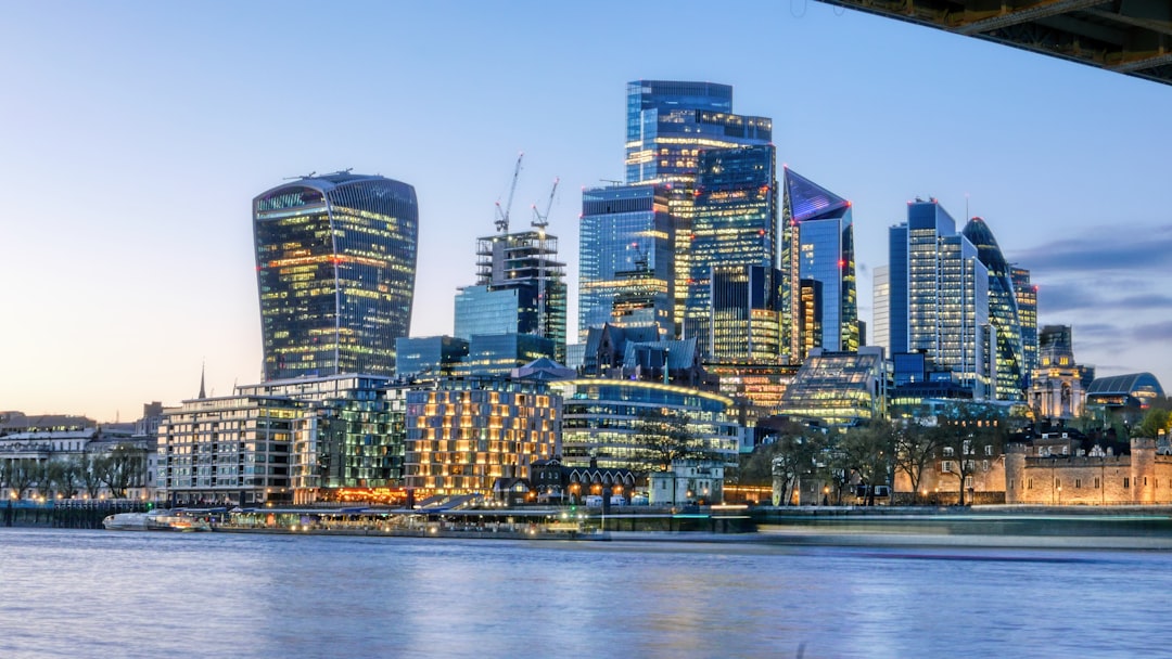 City of London financial district skyline, home to law firms handling offshore UK security and Report on Title work
